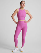 pink high-waisted midi length leggings.